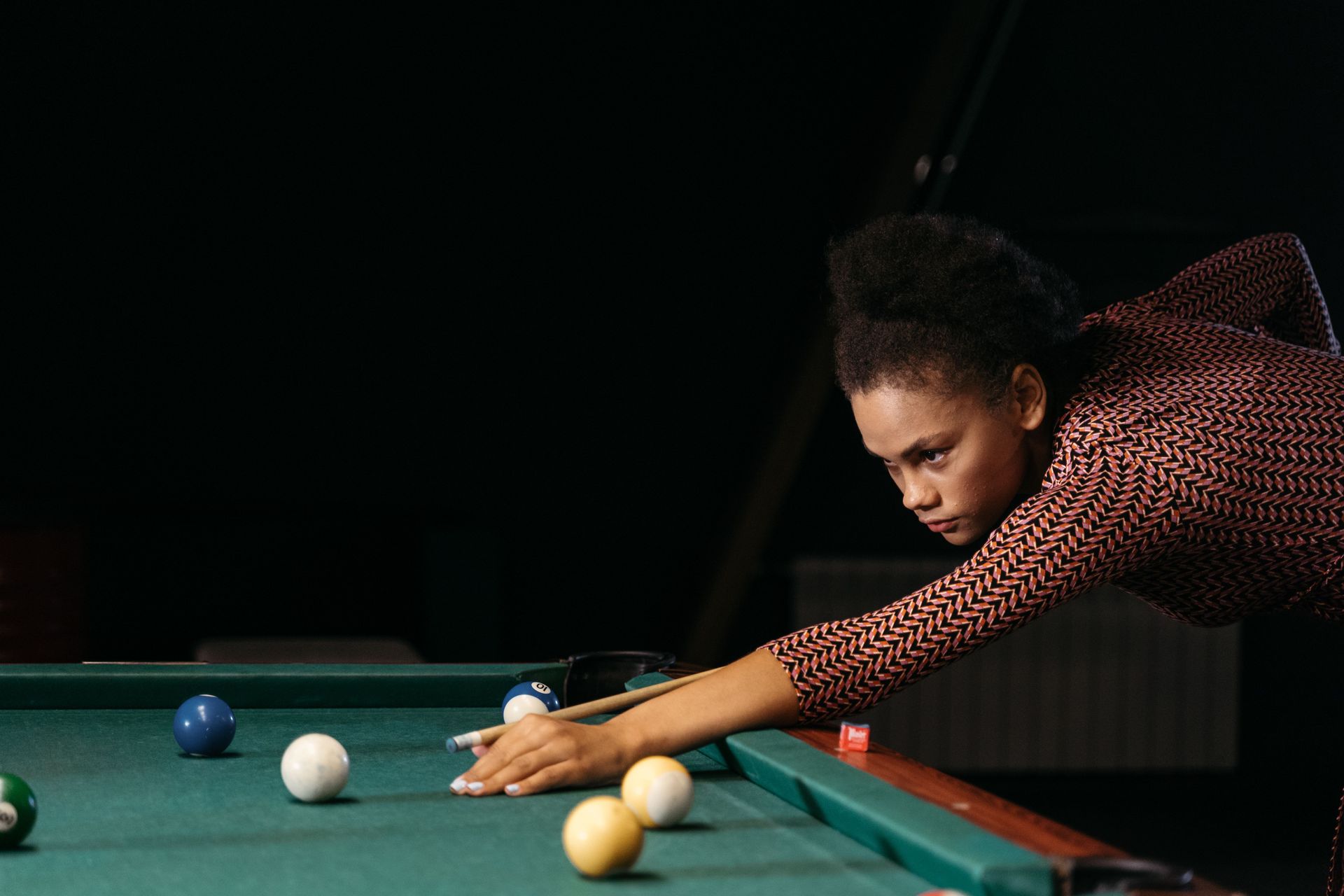 Woman playing pool