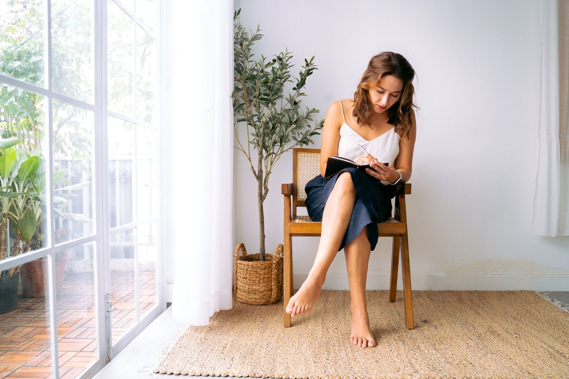 Woman writing in a journal