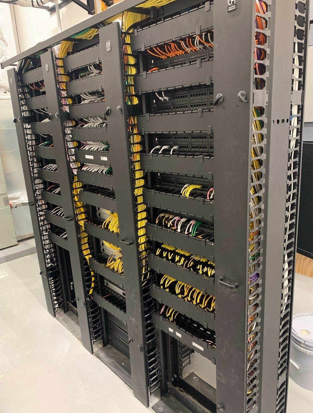 A server rack filled with lots of wires and cables.