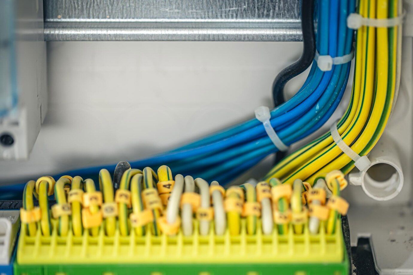 A bunch of wires are connected to each other in a box.