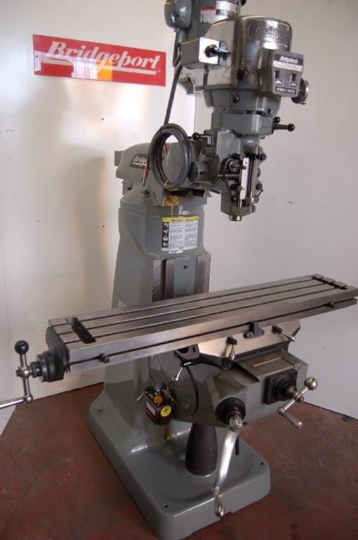 A man is working on a machine in a factory.
