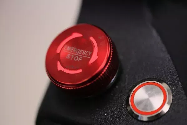 A red button that says emergency stop on it