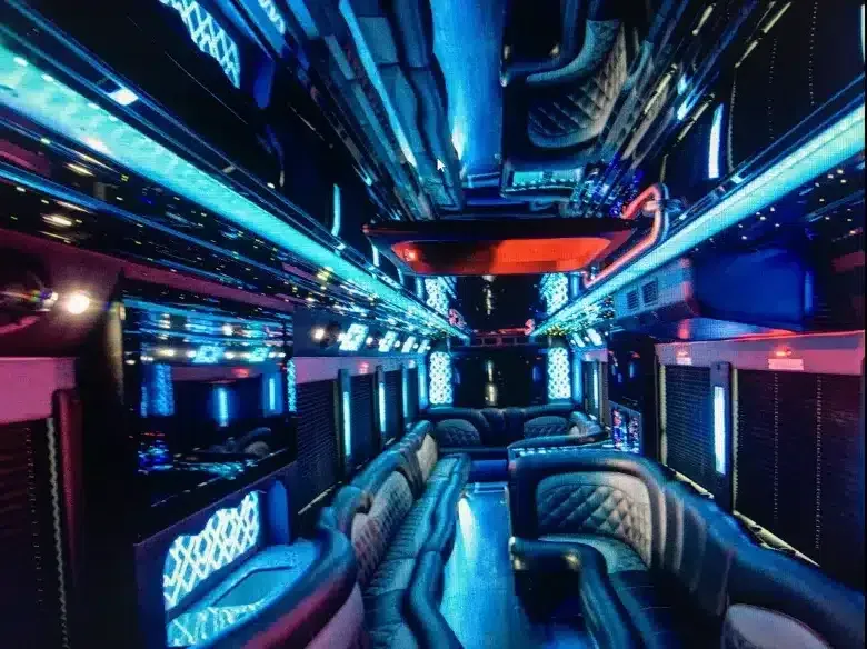 Futuristic neon-lit luxury bus interior with blue and purple lighting and plush seats