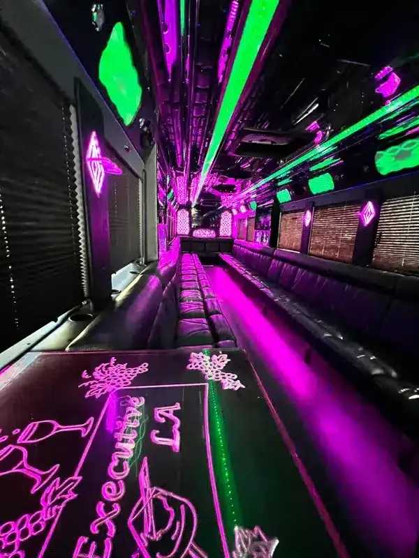 Neon-lit futuristic corridor with magenta and green lights and glowing floor graphics
