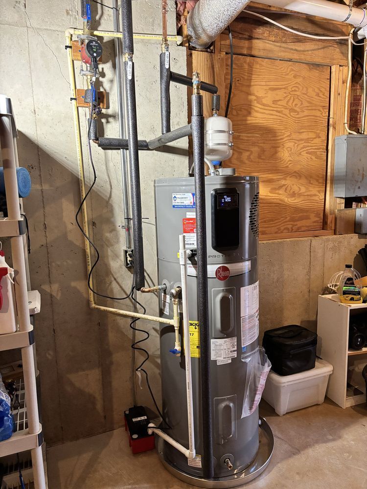 Water heater and plumbing equipment in a basement utility room.
