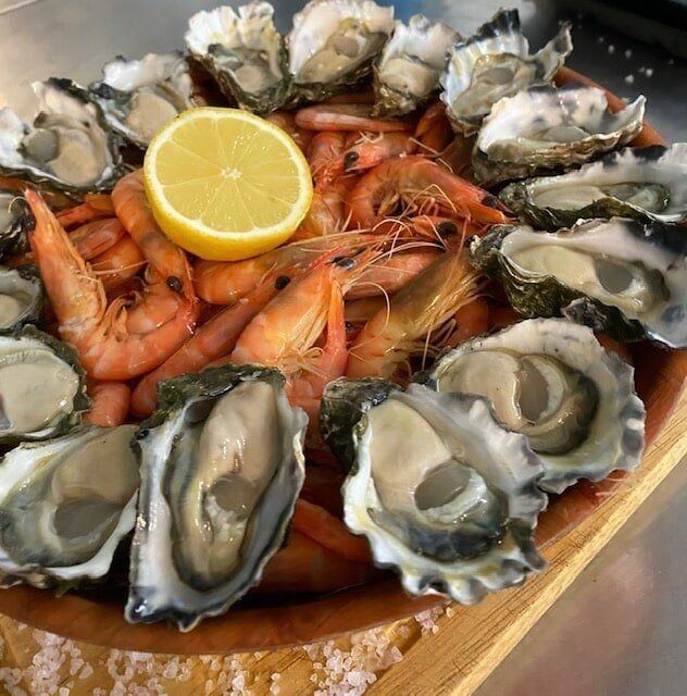 Oysters on A Wooden Cutting Board — Stones Oysters & Shed Takeaway in Taree, NSW