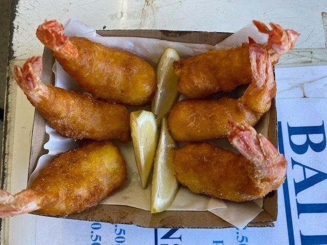 A Box of Fried Shrimp Sits on A Table — Stones Oysters & Shed Takeaway in Harrington, NSW