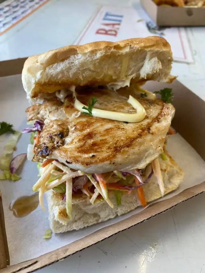 A Close Up of a Sandwich in a Box on a Table — Stones Oysters & Shed Takeaway in Taree, NSW