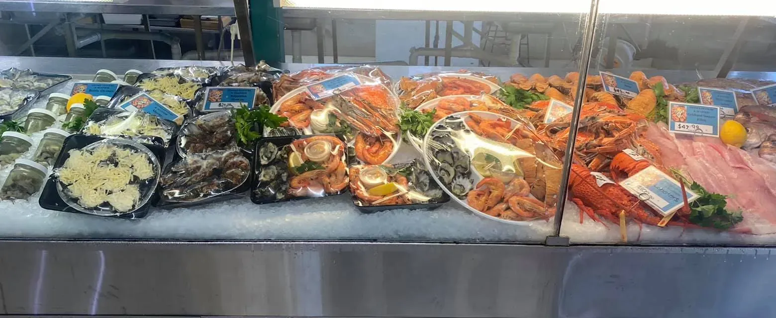 A Display Case Filled With Lots of Different Types of Seafood — Stones Oysters & Shed Takeaway in Taree, NSW