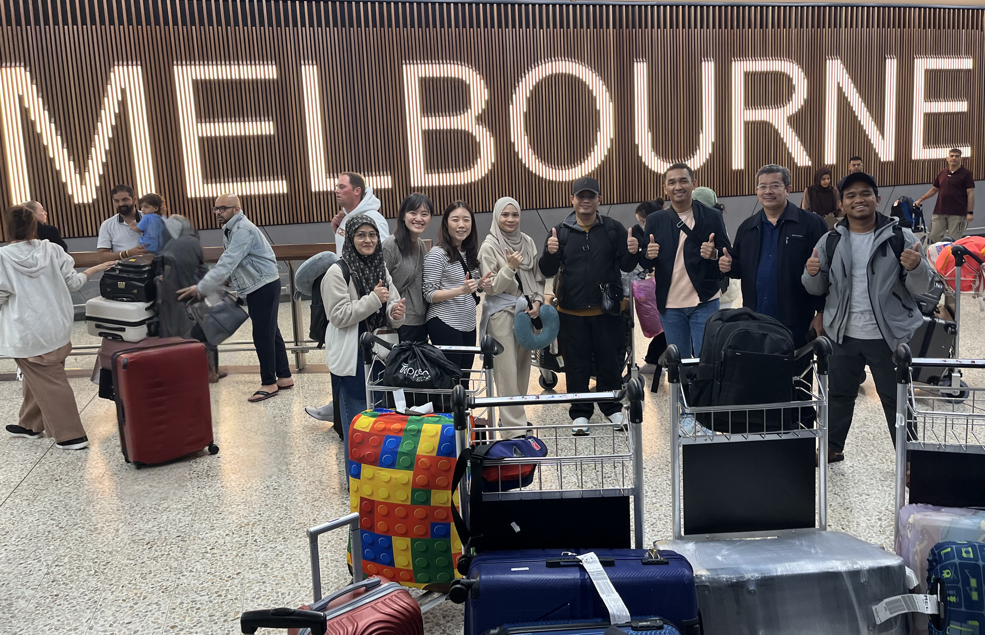 A group of happy Ticket 2 Ride customers at Melbourne Airport