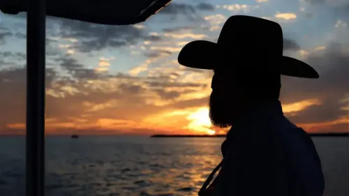 Man enjoying sunset cruise Panama City Beach with Reel Groovy charter