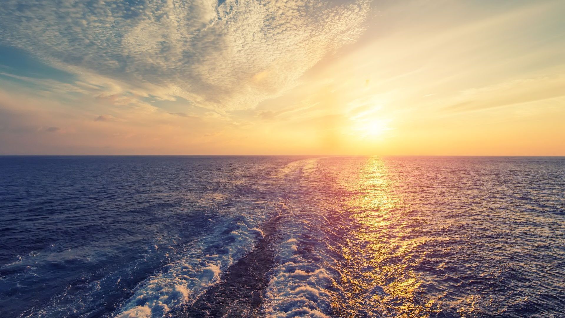 Sunset over Gulf during booze cruise Panama City Beach with Reel Groovy Experiences