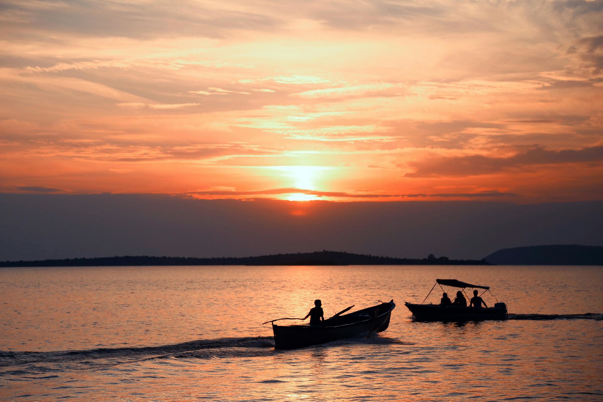 Fishing charter boats on Gulf of Mexico at sunset near Panama City Beach Florida for deep sea fishing adventures