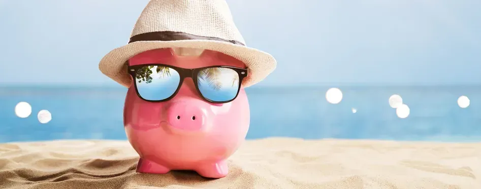 Piggy bank on the beach representing deep sea fishing charter prices in Panama City Beach Florida