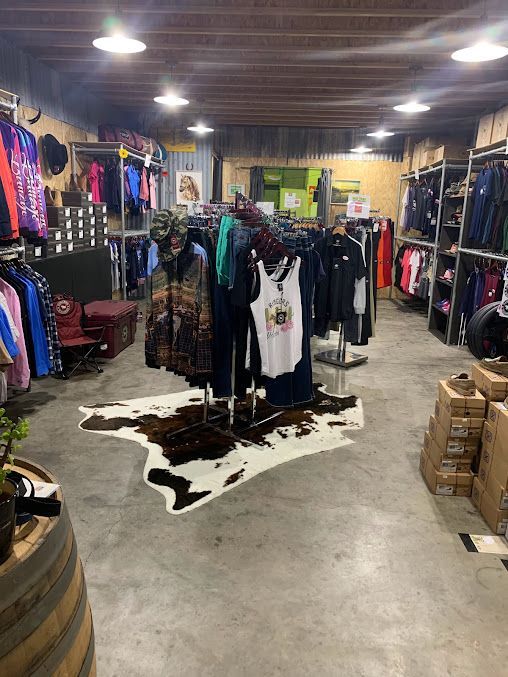 A Store Filled with Clothes and A Cowhide Rug — Country Charm in Charmhaven, NSW