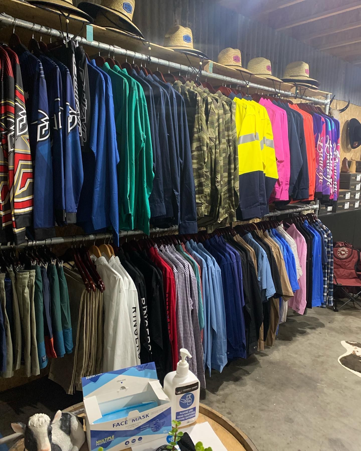 A Store Filled with Lots of Clothes Hanging on Racks — Country Charm in Charmhaven, NSW