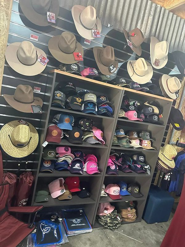 A Store Filled with Lots of Cowboy Hats and Baseball Caps — Country Charm in Charmhaven, NSW