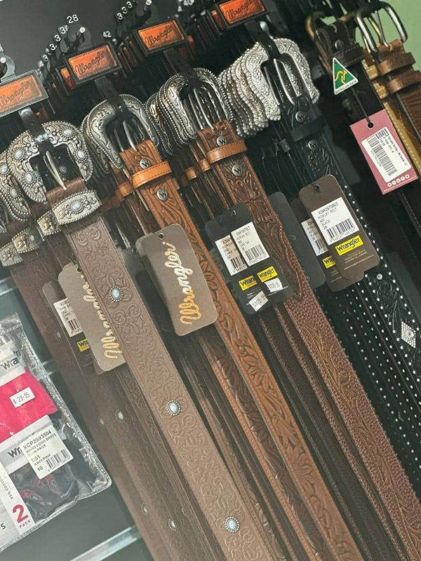 A Bunch of Belts Are Lined up In a Row in A Store — Country Charm in Charmhaven, NSW