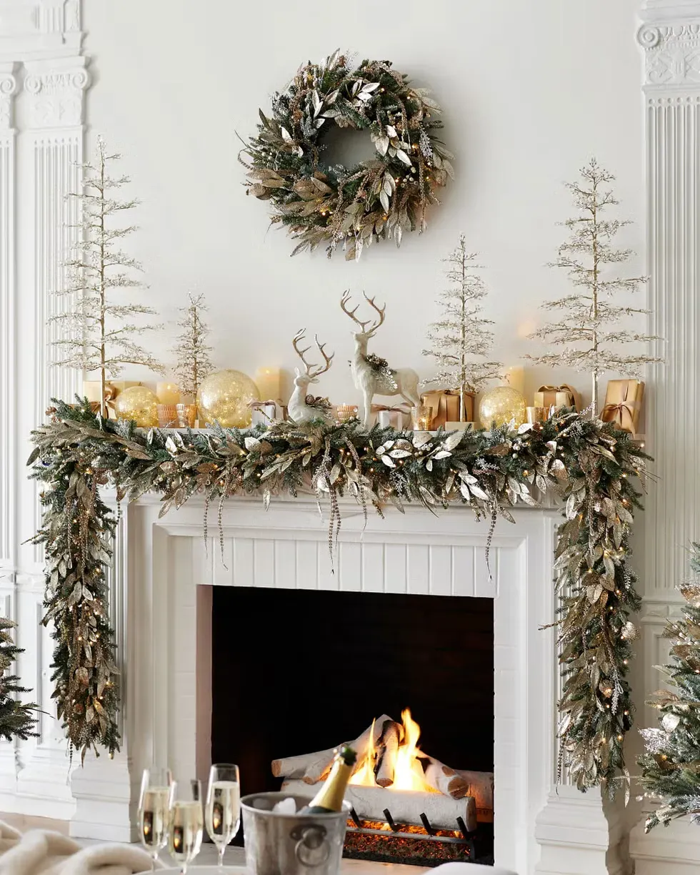 A fireplace decorated for christmas with a wreath and a bucket of champagne. A fireplace decorated for christmas with a wreath and a bucket of champagne.