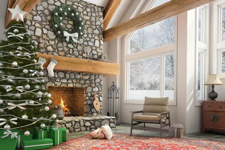 A living room decorated for christmas with a christmas tree and fireplace. A living room decorated for christmas with a christmas tree and fireplace.