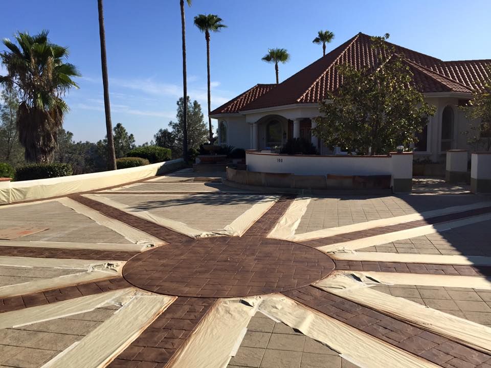 A large house with a circular driveway in front of it
