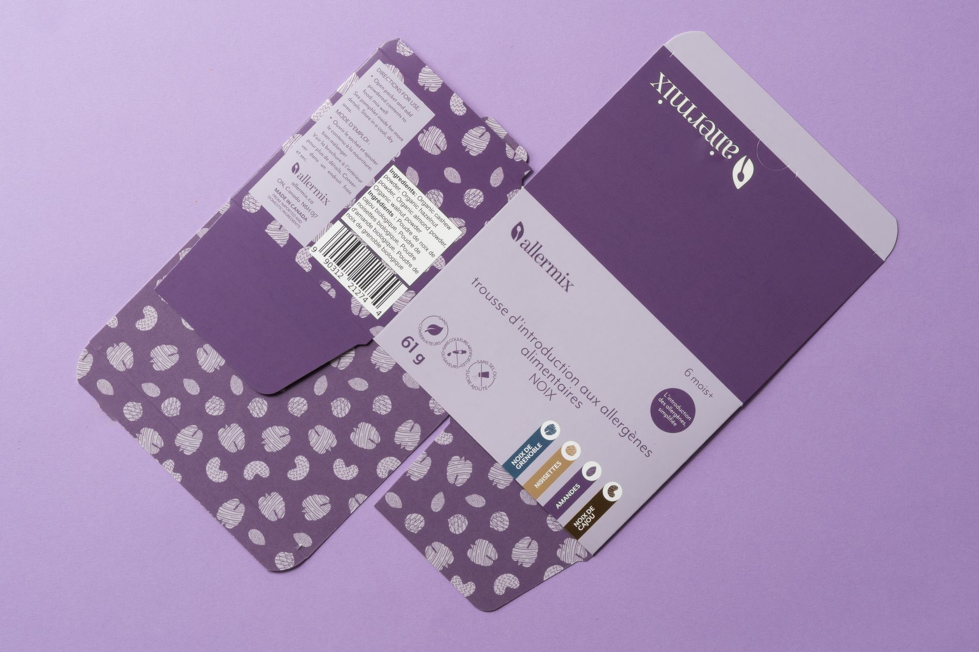 Purple stationery set with matching patterned folder, notebook, and pen on a lavender background