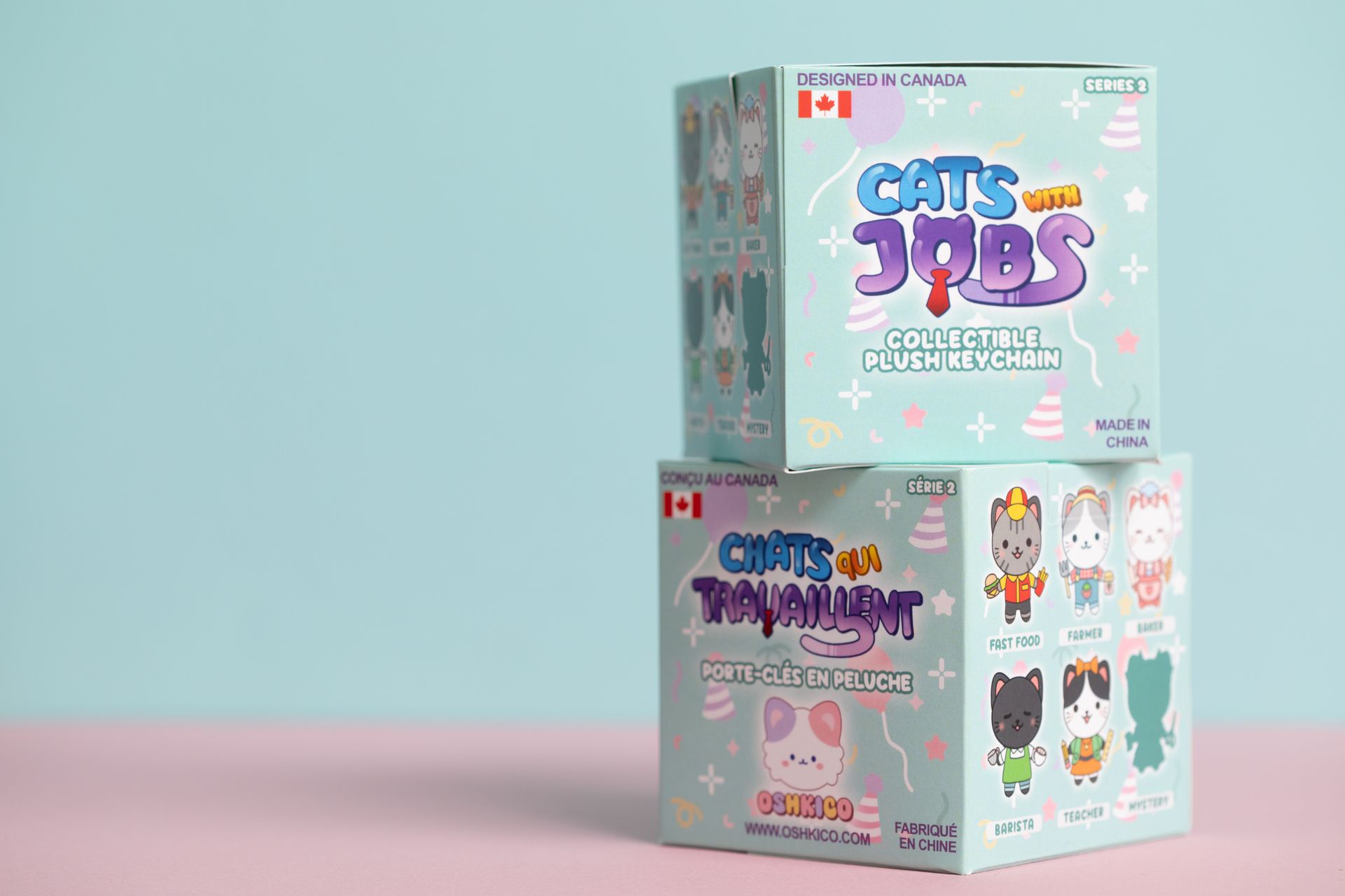 Stacked pastel blind-box toy packages with cute cartoon faces on a pink-and-blue background