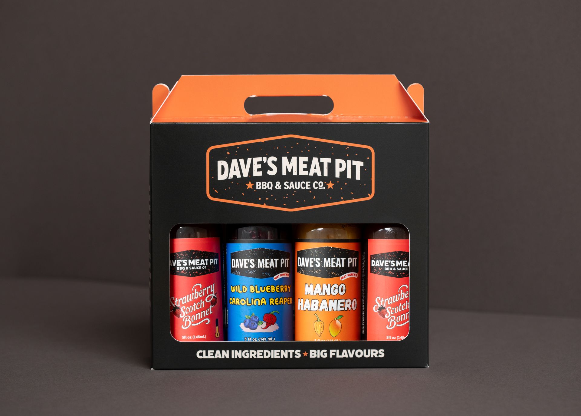 Dave’s Meat Pit seasoning gift set in black and orange packaging with three spice bottles