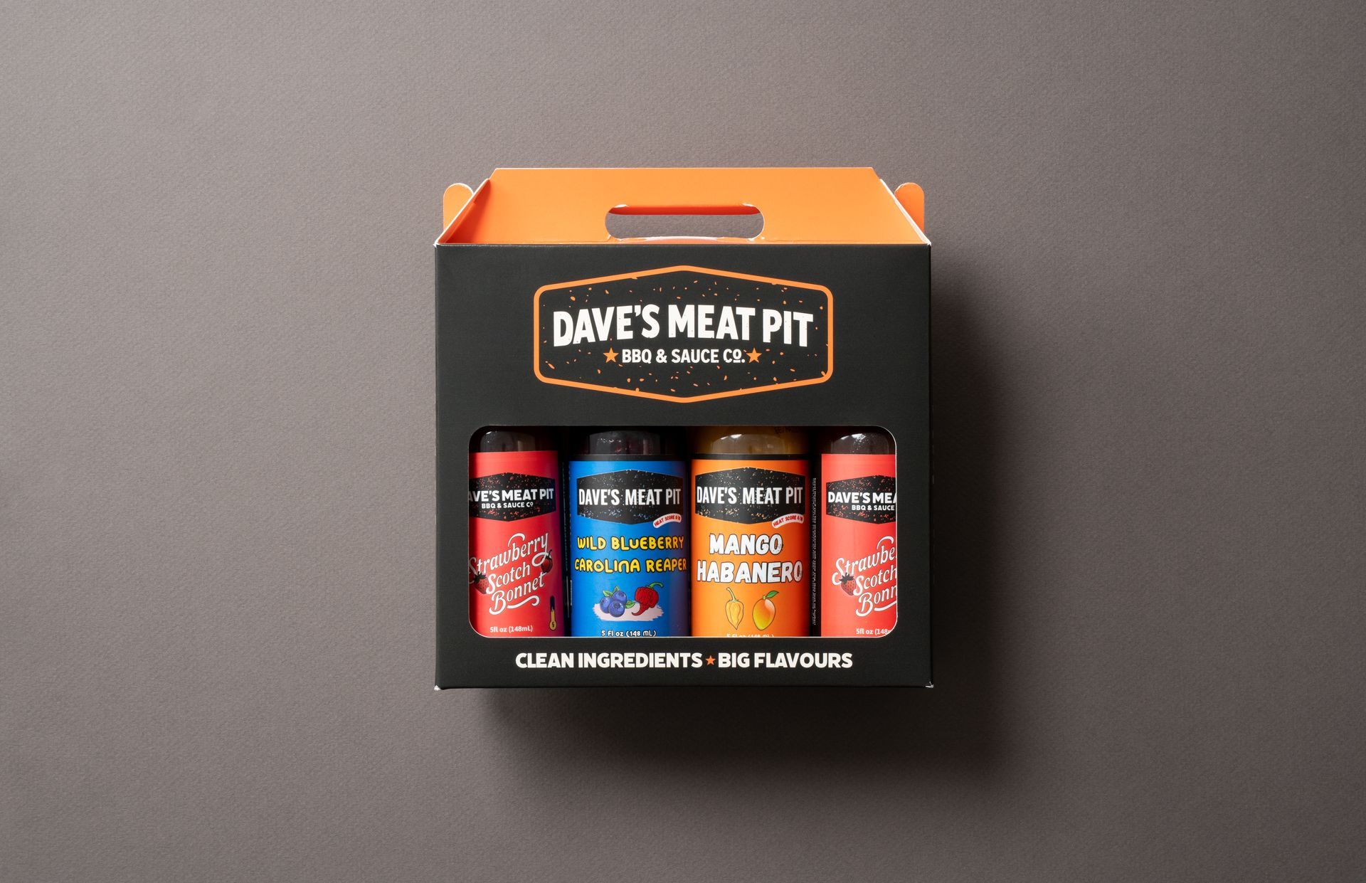 Dave's Meat Pit seasoning gift set in black box with orange accents on a gray background