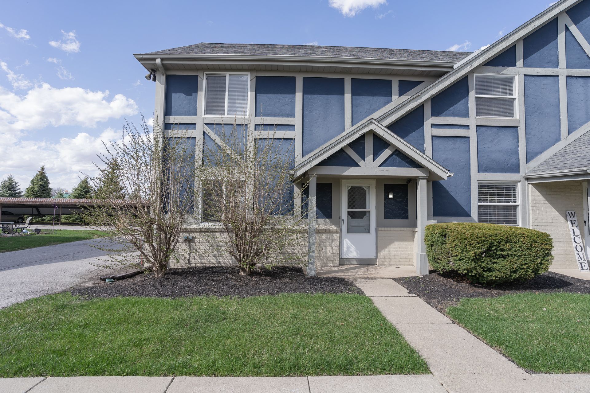 photo of a blue multi-family home
