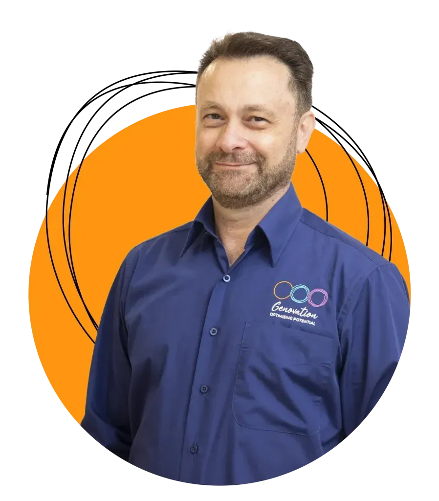 A man with a beard wearing a blue shirt that says Genovation on it
