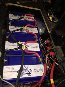 A bunch of batteries are connected to each other in a car.