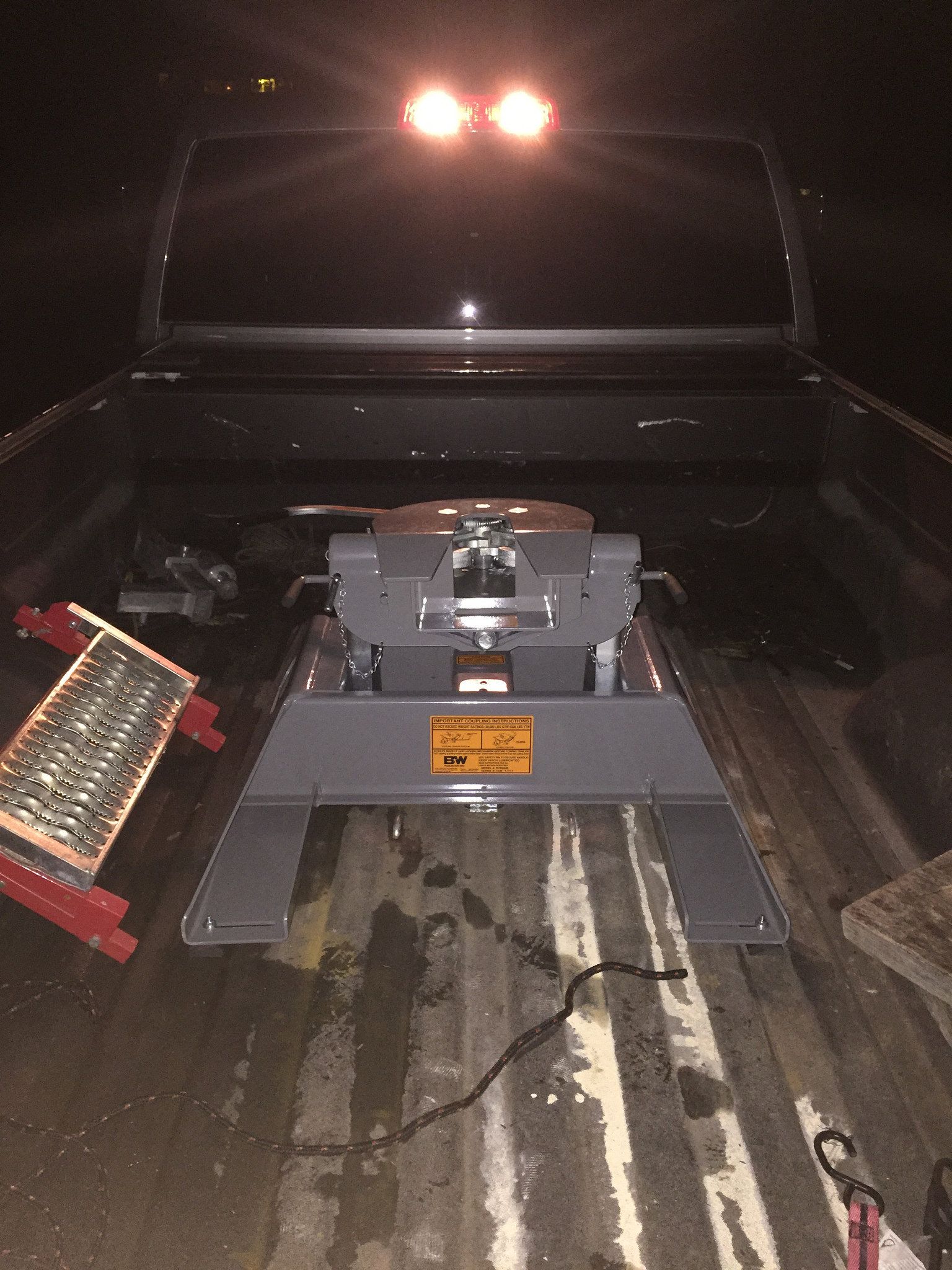 A trailer hitch is sitting in the back of a truck