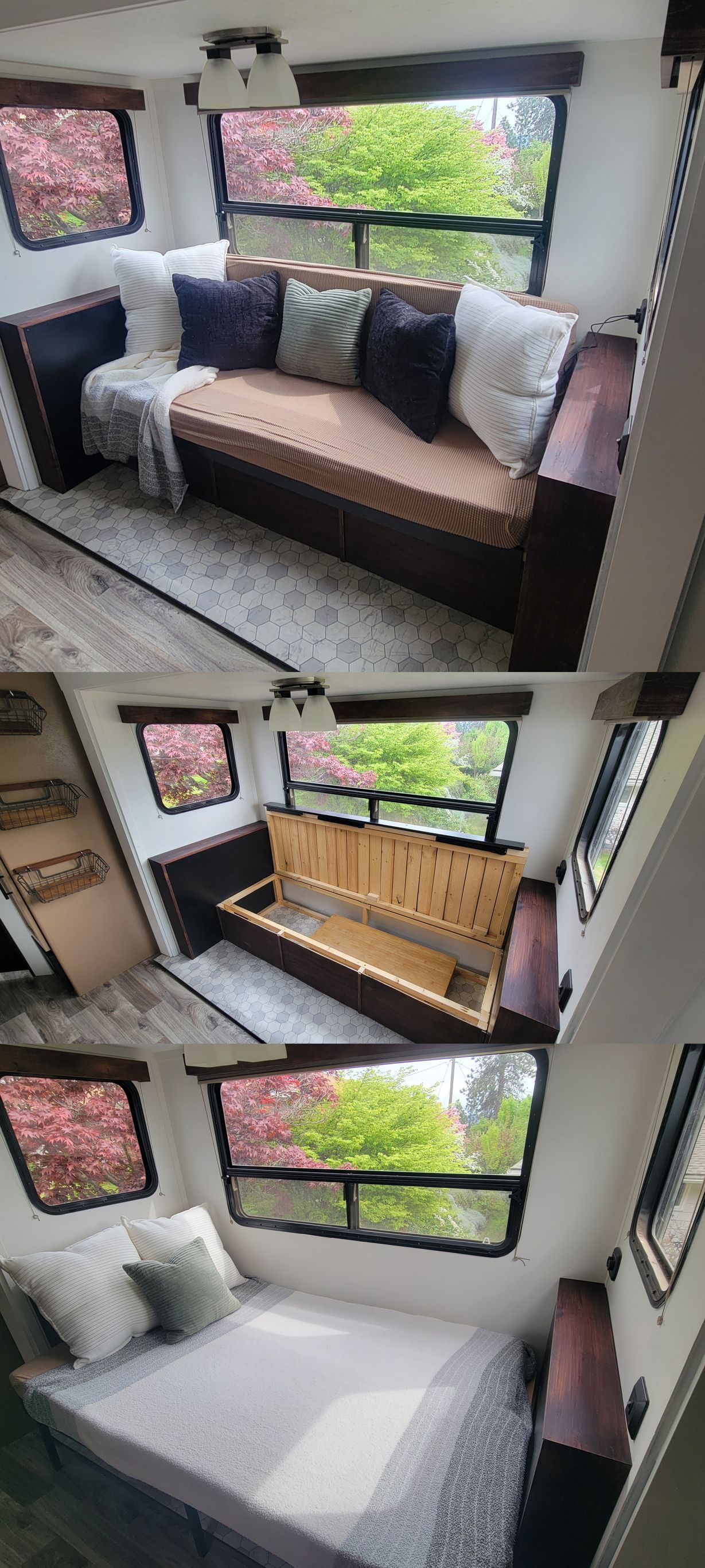 A RV interior with a convertible sofa bed near windows.