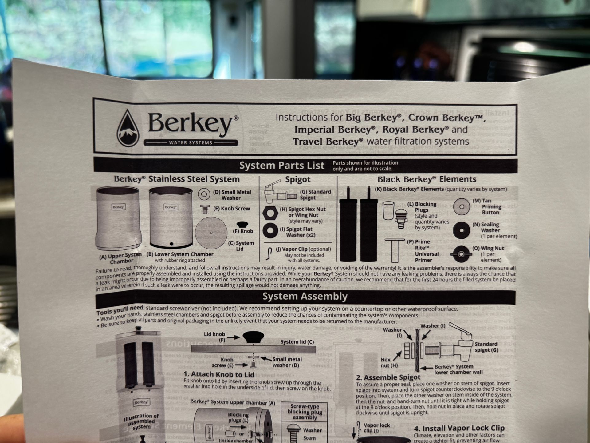 Instruction sheet for Berkey water filter systems. Features parts list and assembly diagrams.