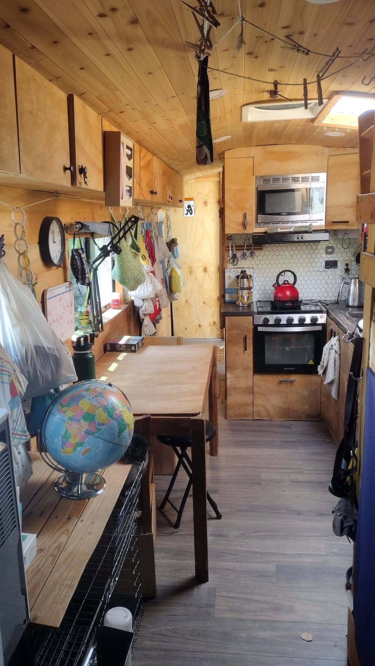 There is a globe on the table in the kitchen.