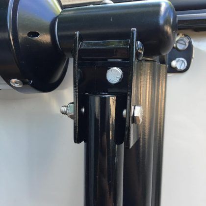 A close up of a metal pole with a screw on it.