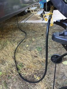 A close up of a power cord connected to a trailer.