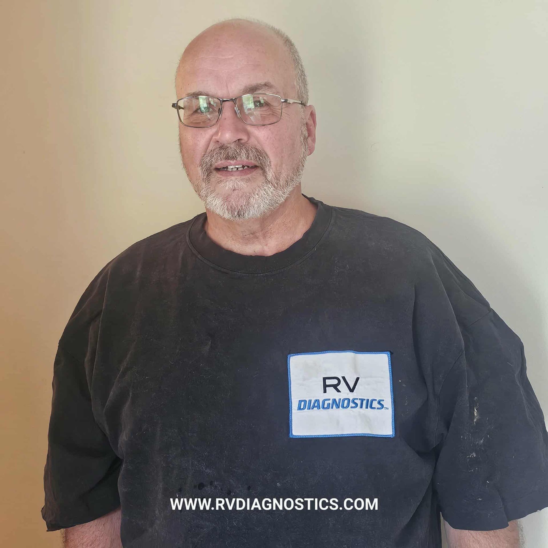 Man wearing glasses and a black shirt with 