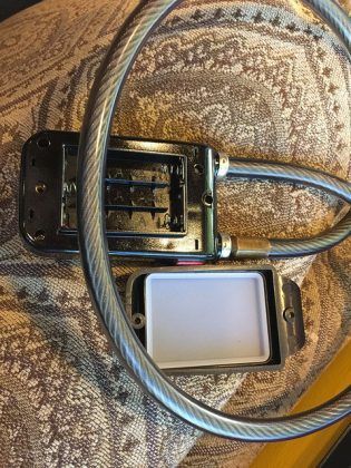 A close up of a cell phone sitting on top of a table.