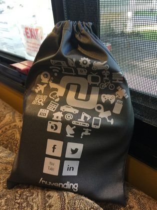 A black drawstring bag with social media icons on it