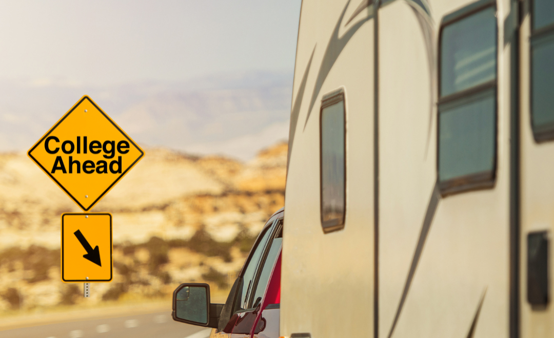 A yellow sign on the side of a road that says `` college ahead ''.