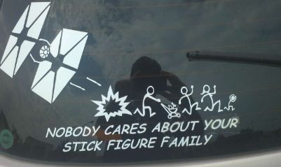 Dark car-window decal showing a TIE fighter, explosions, stick figures, and text: “Nobody cares about your stick figure family”