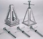 A couple of metal stands sitting on top of each other on a table.