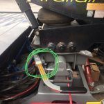 A close up of a machine with a green circle around it.