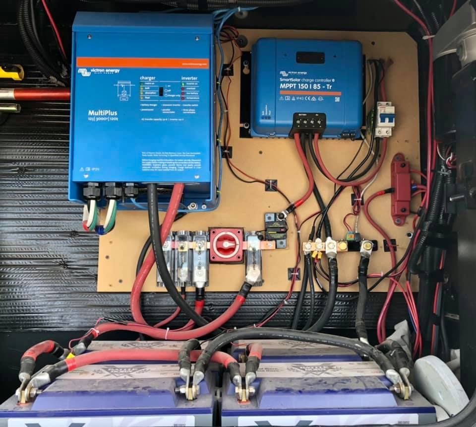 A bunch of wires are connected to a blue box that says voltplus