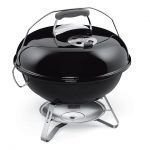 A black barbecue grill with a handle on a white background.