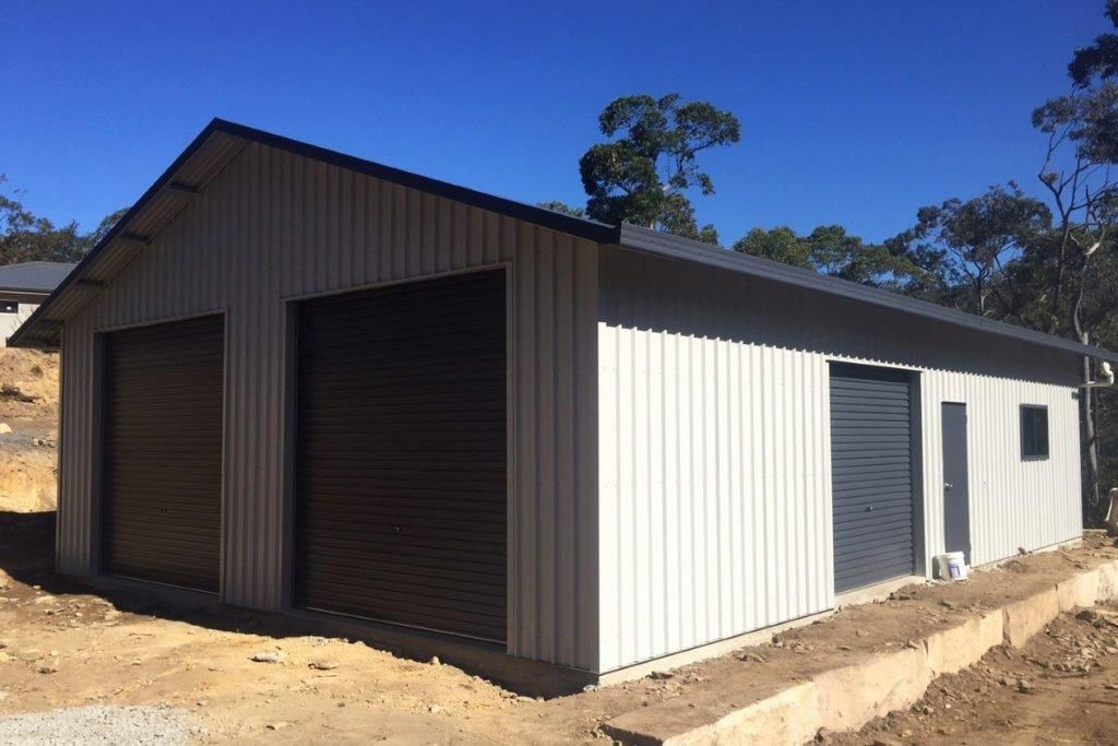 Large beige metal shed with open garage bays — More Than Garages Pty Ltd–Ranbuild Tamworth in Taminda, NSW