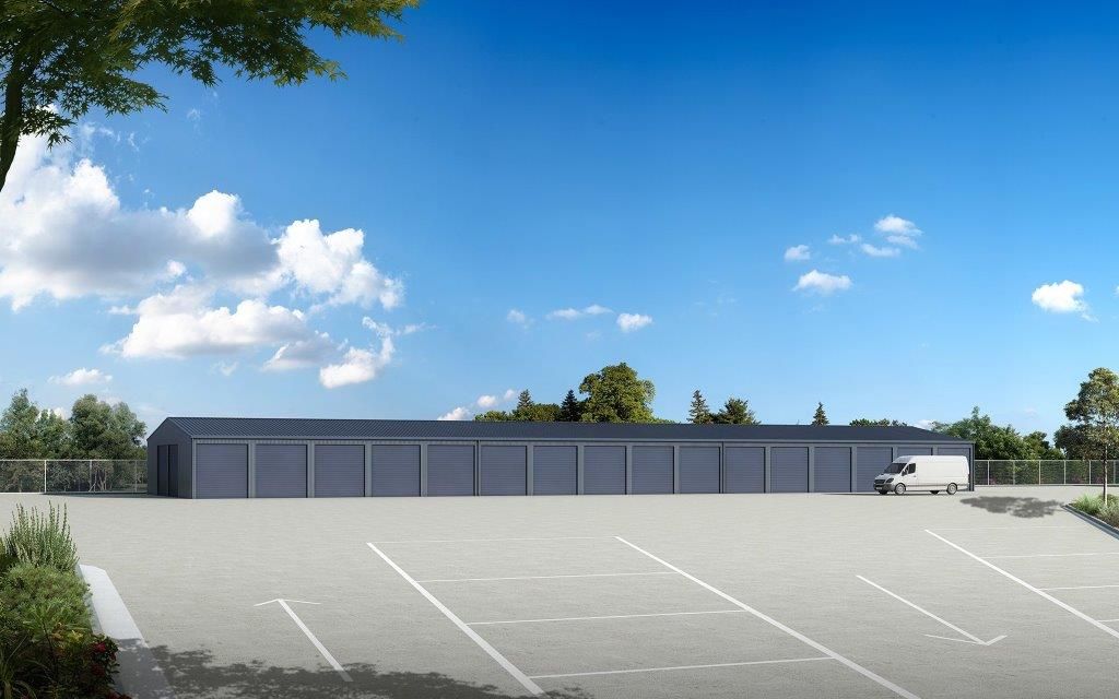 A Row Of blue garage Doors On A Building — More Than Garages Pty Ltd–Ranbuild Tamworth in Taminda, NSW