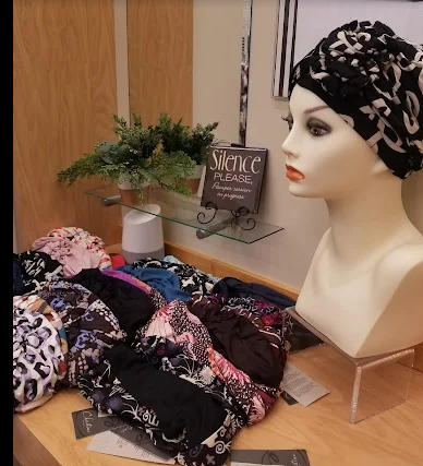 Display of various colorful sun hats, including straw, lavender, and blue. Display of various colorful sun hats, including straw, lavender, and blue.